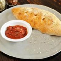 Johnny's Italian Special Calzone · Fold pizza dough with pepperoni, sausage, mushrooms, onion and green peppers with seasoned r...