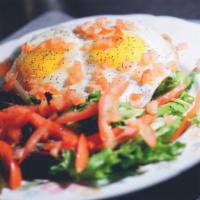 Eggs On Toast · Rustic bread, sunny side, eggs and small green salad. Vegetarian.