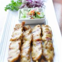 Chicken Satay · Marinated chicken grilled on skewers served with peanut sauce and cucumber vinaigrette dip.