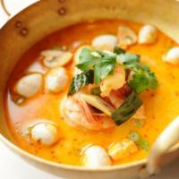 Tom Yum Soup · Hot and sour shrimp broth with lime juice, chili tamarind paste, hot chilies, mushrooms, and...