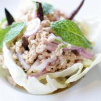 Larb E-Sarn Salad · Lettuce wrap. Choice of ground pork or chicken tossed with chili powder, red onions, mint, c...