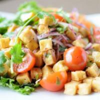 26. Crispy Tofu Salad · Crispy tofu, lettuce, cucumber, tomatoes, red and green onions, cilantro and mint leaves ser...