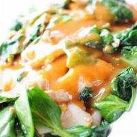 Rama Noodle · Sautéed wide rice noodles and egg served on bed of spinach and topped with peanut sauce.