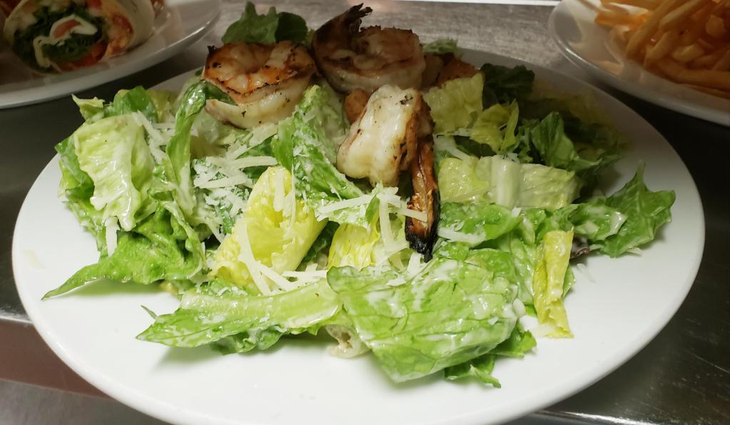 Caesar Salad · Romaine lettuce with parmesan cheese, caesar dressing and croutons. Option to include grilled chicken or grilled shrimps.
