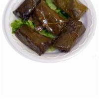 14. Stuffed Grape Leaves · Grape leaves filled with herbed rice. Vegetarian.
