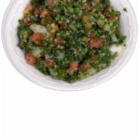 17. Tabbuleh · Chopped parsley mixed with tomatoes, onion, bulgur, lemon juice and olive oil. Vegetarian.