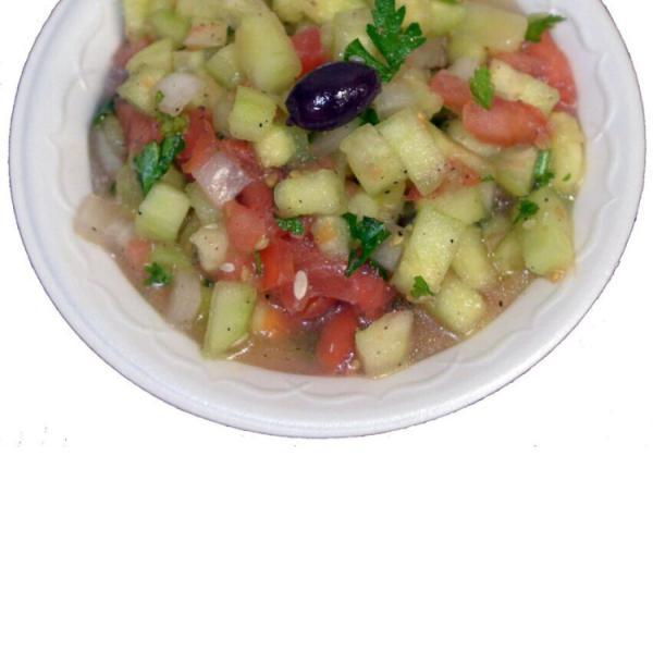 18. Shirazi Salad · Chopped cucumber, tomatoes, onion, parsley mixed with lemon juice and olive oil. Vegetarian.