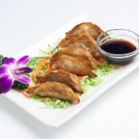 Gyoza (Pot Sticker) · Fried dumplings filled with ground chicken, cabbage and scallion served with sweet soy sauce...