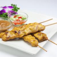 Satay Chicken · Skewered slice of marinated chicken served with peanut sauce and cucumber vinaigrette.  (4pc...
