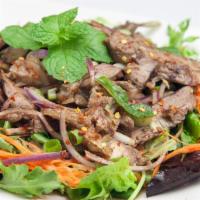 Beef Salad (Yum Nua) · Grilled sliced steak with spring mix salad, scallion, red onion, lime juice, chili, carrot, ...