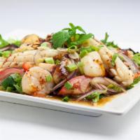Spicy Shrimp Salad · Grilled shrimp with spring mix salad, lime juice, chili, red onion, lemon grass, tomato, sca...