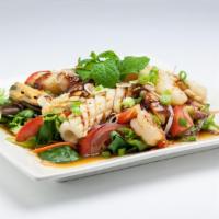 Spicy Calamari Salad · Grilled calamari with spring mix salad, lime juice, chili, red onion, lemon grass, tomato, s...