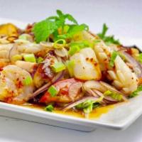 Spicy Seafood Salad · Shrimp, calamari, fish with spring mix salad, lime juice, chili, red onion, lemon grass, tom...