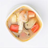 Large Tom Yum · Lemon grass soup, mushroom, tomato, chili paste, lime juice and cilantro sprinkles.