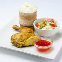 Kai Yang Som Tum · Grilled chicken served with papaya salad and sticky rice.