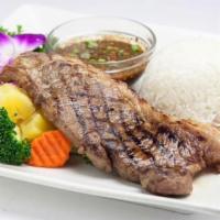 Tiger Cry Steak · Grilled New York Steak, broccoli, carrot, pineapple served with authentic Thai spicy sauce s...