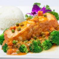 Panang Salmon · Grilled salmon topped with thick Panang curry sauce, pea-carrot, broccoli, carrot served wit...