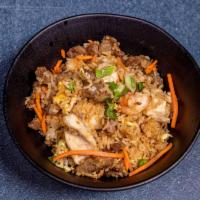 Combination Fried Rice · Shrimp, chicken, beef, green peas, carrots and onions.