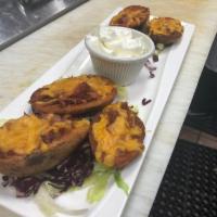 Potato Skins · Bacon and melted cheddar cheese, served with sour cream.
