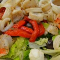 Grilled Shrimp and Calamari Salad · Marinated grilled shrimp and calamari, fresh mozzarella cheese, roasted peppers, olives and ...