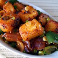 Chili Paneer · Spicy paneer bites battered with flour and sauteed with bell peppers, spring onions, chilies...
