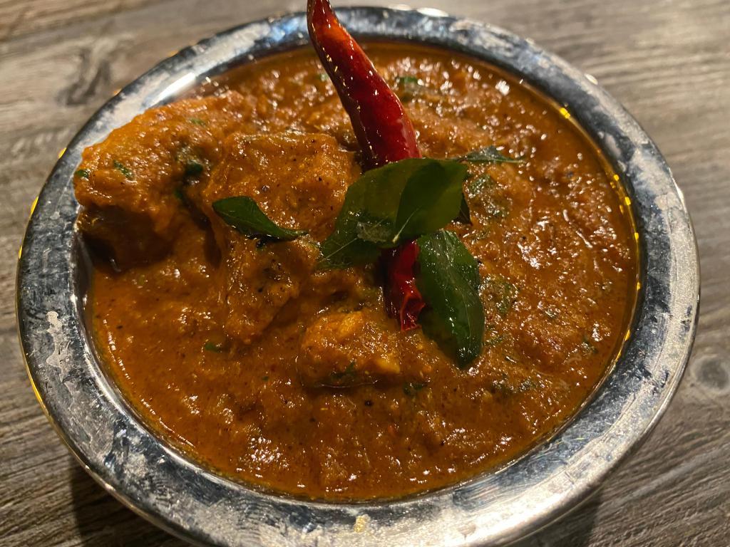 Lamb or Goat Pepper Masala · Boneless Lamb or Goat Bone-In cooked with dry-roasted spices and crushed black pepper from Tamil Nadu. Spicy. Served with Complimentary White Basmati Rice.