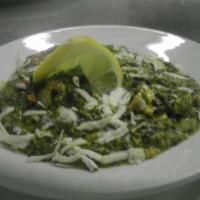 Saag Paneer · Paneer cooked with spinach, garlic, ginger, onions and Indian spices. Gluten free.

Served w...