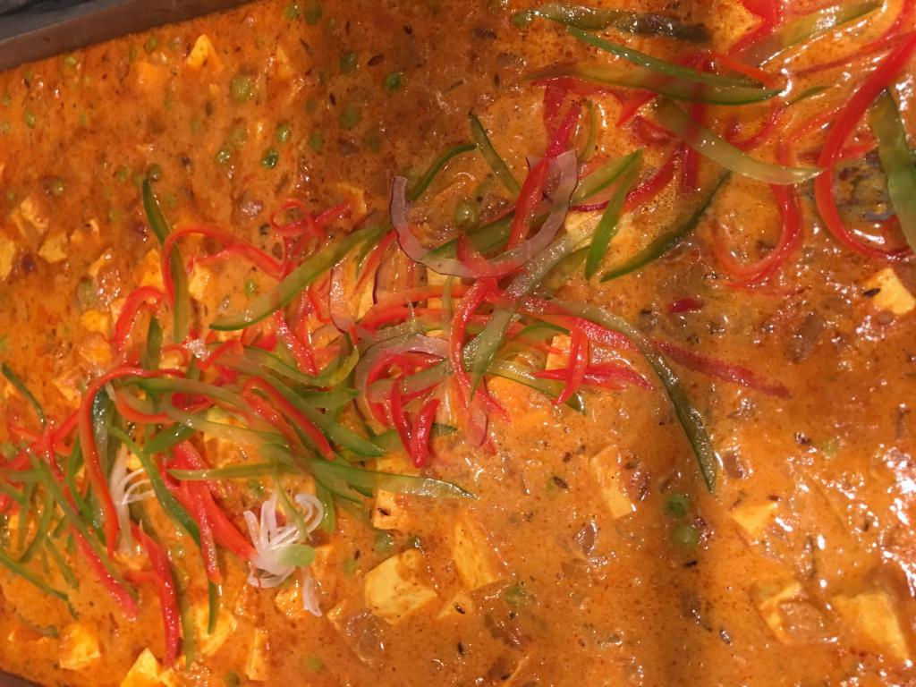 Paneer Tikka Masala · Cubes of paneer in a smooth, creamy butter gravy with honey with bell peppers & onion. Gluten free.