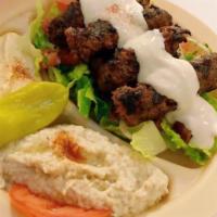 Combination Special · Hummus, babaganoush with choice of gyro, shawarma or lamb kafta kabob. Topped with tahini sa...