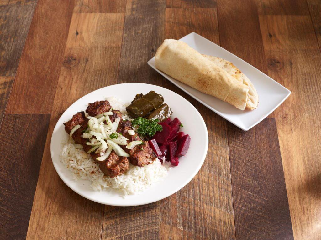 #6 Beef Lule Kabob · Seasoned ground  beef. Served with choice of rice, salad or french fries, pita bread, and any two appetizers.