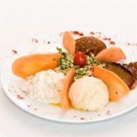 Small Mixed Appetizers · Hummus, spicy ezme, eggplant with sauce, baba ganoush, labneh, and tabbouleh.