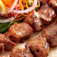 Lamb Shish Kebab · Specially marinated cube of lambs. Entrées are served with pickled red cabbage, carrot salad...