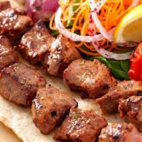 Beef Kebab Plate · Marinated cubes of tender beef skewered and cooked over an open flame grill. Served with ric...