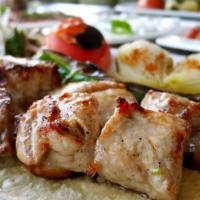Lamb Kebab Plate · Marinated cubes of tender cubes of lamb skewered and cooked over an open flame grill. Served...