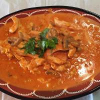 Chicken Stroganoff · Chicken cubes cooked with a special heavy cream sauce with mushrooms and corn. Served with a...