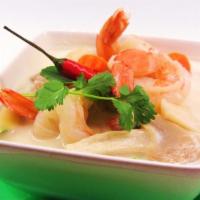 Tom Kah Seafood Soup · Seafood in exotic coconut soup with cabbage, herb, chili and mushrooms.
