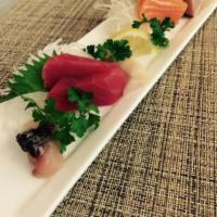 Sashimi Appetizer · 8 pieces of variety fresh fish, tuna, salmon, white tuna and shrimp.