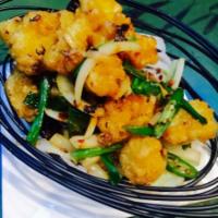 Salt & Pepper Calamari · Battered crispy calamari tossed with Himalayan salt & Thai Spices.
