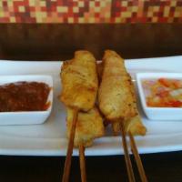 Satay · Four pieces. Thai style grilled chicken on skewers glazed with peanut sauce, pickled vegetab...