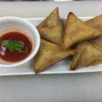 5. Samusa · 5 piece. Triangle flour wrap filled with potatoes, onions and unique spices, served with hou...