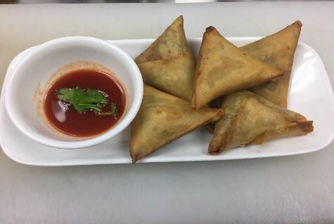 5. Samusa · 5 piece. Triangle flour wrap filled with potatoes, onions and unique spices, served with house sauce.