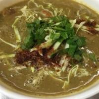 23. Samusa Soup · 2 samusa and 1 falafel cut into pieces then put in the house special soup with cabbage and m...