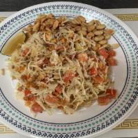 12. Ginger Salad · Pickled ginger, cabbage, lettuce, tomato, fried yellow beans, sunflower seeds, peanuts and s...