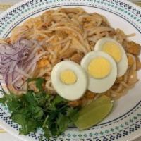 24. Nan Gyi Dok · Thick rice vermicelli mixed with coconut diced chicken sauce, bean powder, red onion, cilant...