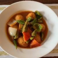 32. Okra Egg Curry · Okra and fried hard boiled egg cooked with green and red bell peppers, yellow onions and hou...