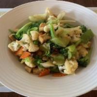 39. Fried Vegetables · Broccoli, snow peas, cabbage, cauliflower, carrot, mushroom, green bean and soft tofu cooked...