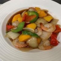 42. Mango Shrimp · Mango stir fry with shrimp, green onions, red and green peppers.