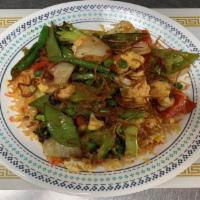 53. Vegetable Biryani · Biryani rice comes with green peas, carrot, cashews, raisin and fried onion on top. Vegetari...