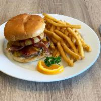 Smokehouse Burger · Crispy onion rings, bacon, cheddar, BBQ sauce and chipotle mayonnaise.