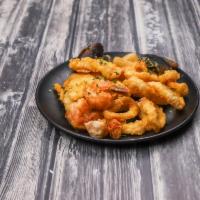 Jalea Limena · Served peruvian style fried seafood platter with white fish, calamari, shrimp, scallops, cla...